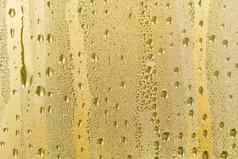 摘要背景点缀金水滴雨滴金颜色闪闪发光的闪亮的水表面玻璃水滴形式球球体彩色的雨滴