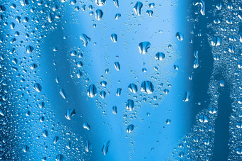 雨滴玻璃多雨的天气闪闪发光的闪亮的表面水玻璃水滴形式球球体灰色雨滴背景摘要背景点缀水