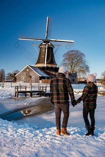 佩尔莫伦有霍斯特赖森覆盖雪景观上艾瑟尔省荷兰历史风机冬天白色景观