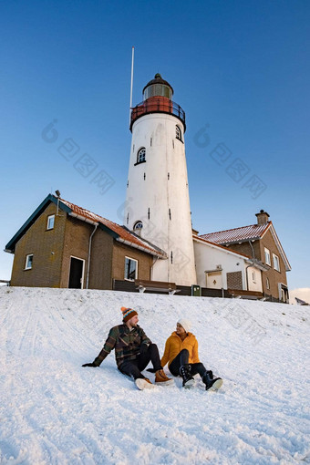 urk荷兰灯塔冬天雪覆盖海岸线urk视图灯塔雪景观冬天天气荷兰