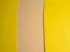 撕裂边缘黄色的纸板米色背景摘要背景阴影