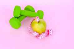 绿色苹果厘米测量磁带粉红色的背景体育体育营养健康的吃饮食空间文本