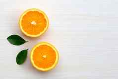 高维生素多汁的甜蜜的新鲜的橙色水果绿色叶子表格纹理背景