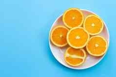 切片橙子蓝色的背景高维生素多汁的甜蜜的