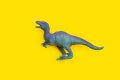 塑料恐龙玩具黄色的背景