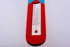 玩具形状的红色的温度计背景