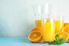 作文新鲜的橙色汁玻璃器皿薄荷木榨汁机颜色表格白色背景空间文本新鲜的自然喝