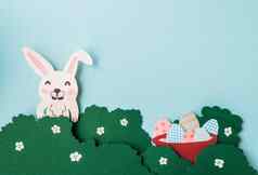 Diy纸卡片复活节体积问候卡片邀请兔子灌木装饰鸡蛋篮子蓝色的背景纸减少礼物的想法装饰复制空间视图