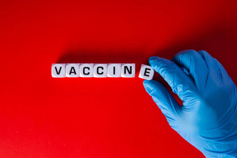 医疗科维德概念医生手单词“疫苗”