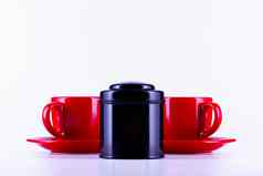 红色的杯茶黑色的盒子茶