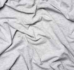 斑驳的灰色的棉花织物服装织物有皱纹的