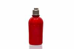 红色的瓶淋浴过来这里奶油白色背景轻量级塑料罐子白色背景硬阴影隔离