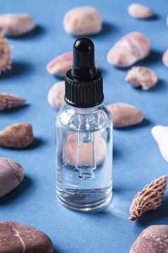 皮肤护理本质石油下降玻璃瓶贝壳鹅卵石