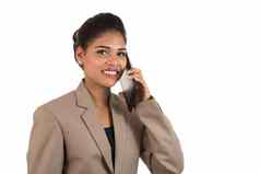 快乐业务女人会说话的移动电话智能手机孤立的白色背景