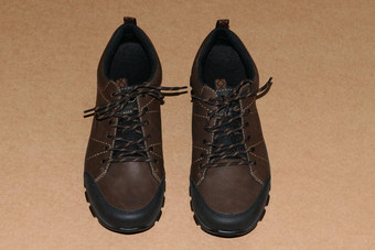 鞋子男人的棕色（的）鞋子运动鞋棕色（的）背景
