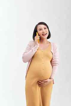 怀孕了女人会说话的电话白色背景沟通怀孕了概念