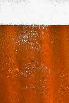 啤酒美丽的细节殴打玻璃啤酒泡沫摘要色彩斑斓的背景