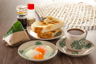 东方早餐集马来西亚组成咖啡<strong>米饭</strong>脂肪烤<strong>面包面包</strong>半熟的蛋