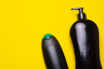 黑色的洗发水背景Copyspace瓶洗发水黄色的背景文章美行业