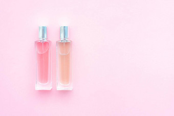 香水瓶粉红色的背景芳香疗法气味香水选择香味粉红色的背景