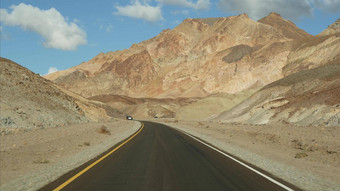 路旅行死亡谷艺术家调色板开车加州美国搭便车汽车旅行美国高速公路色彩斑斓的只山干旱气候荒野视图车旅程内华达