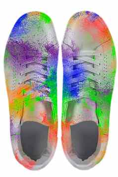 运动鞋覆盖油漆溅色彩斑斓的运动鞋白色背景有创意的鞋子