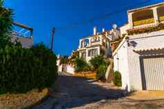 美丽的风景如画的街狭窄的路白色外墙建筑西班牙语体系结构
