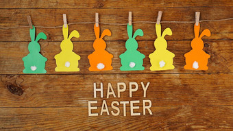 快乐复活节背景加兰纸兔子木背景
