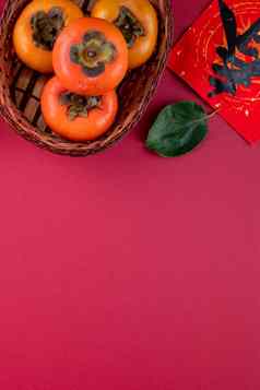 前视图新鲜的甜蜜的柿子叶子红色的表格背景中国人月球一年