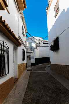 美丽的风景如画的街狭窄的路白色外墙建筑西班牙语体系结构