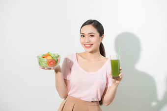 女人绿色排毒冰沙沙拉玻璃碗孤立的白色背景适当的营养素食者食物健康的生活方式节食概念区域复制空间