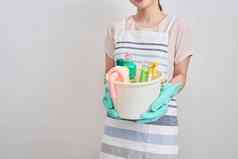 人做家务管家概念快乐女人持有清洁的东西首页