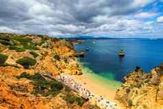 卡米洛海滩沙滩上卡米洛拉各斯阿尔加夫葡萄牙木人行桥海滩沙滩上卡米洛葡萄牙风景如画的视图沙滩上卡米洛海滩拉各斯阿尔加夫地区葡萄牙