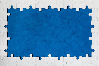 框架形式矩形使白色拼图谜题框架文本拼图谜题框架使拼图谜题块蓝色的背景