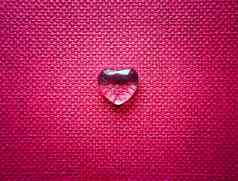 透明的心背景粉红色的纺织纹理完美的情人节一天问候卡背景