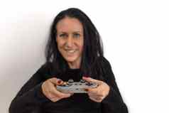 年轻的女人红色的指甲波兰的玩视频游戏复古的无线游戏控制器快乐集中面部表达式孤立的白色背景