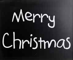 快乐圣诞节手写的白色粉笔黑板上