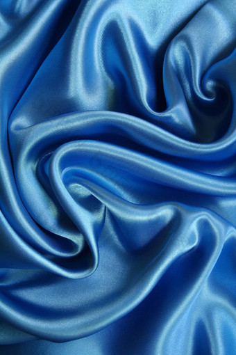 光滑的优雅的黑暗蓝色的丝绸背景光滑的埃莱加