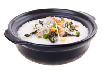 传统的中国人猪肉粥大米粥服务陶罐