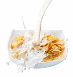 健康的早餐玉米片牛奶飞溅孤立的白色