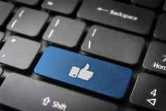 拇指蓝色的键盘关键社会媒体背景