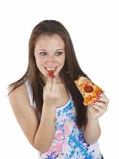 快乐十几岁的女孩吃披萨