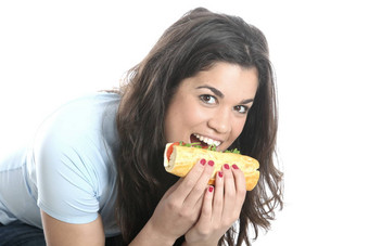 模型发布年轻的女人吃奶酪番茄卷
