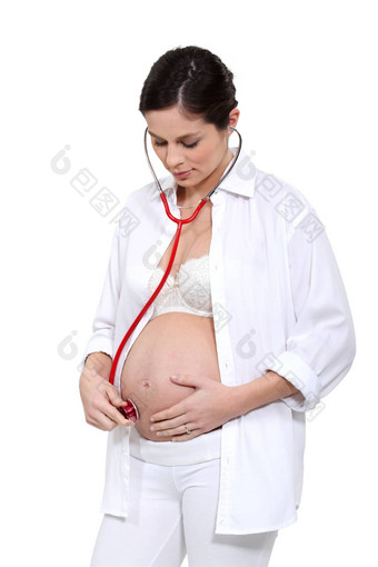 怀孕了女人听婴儿听诊器