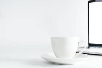 咖啡杯电脑桌面白色办公室桌子上表格