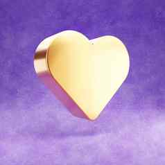 心图标黄金光滑的心象征孤立的紫罗兰色的天鹅绒背景