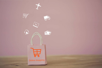 购物在线电子商务概念粉红色的纸购物袋购物<strong>车图标</strong>表格在线商店被认为是媒介交易货物企业家客户
