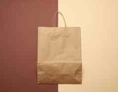 棕色（的）纸袋处理购物棕色（的）背景