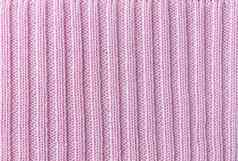 粉红色的垂直行针织针织织物纹理模式