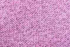 粉红色的针织针织织物纹理模式背景